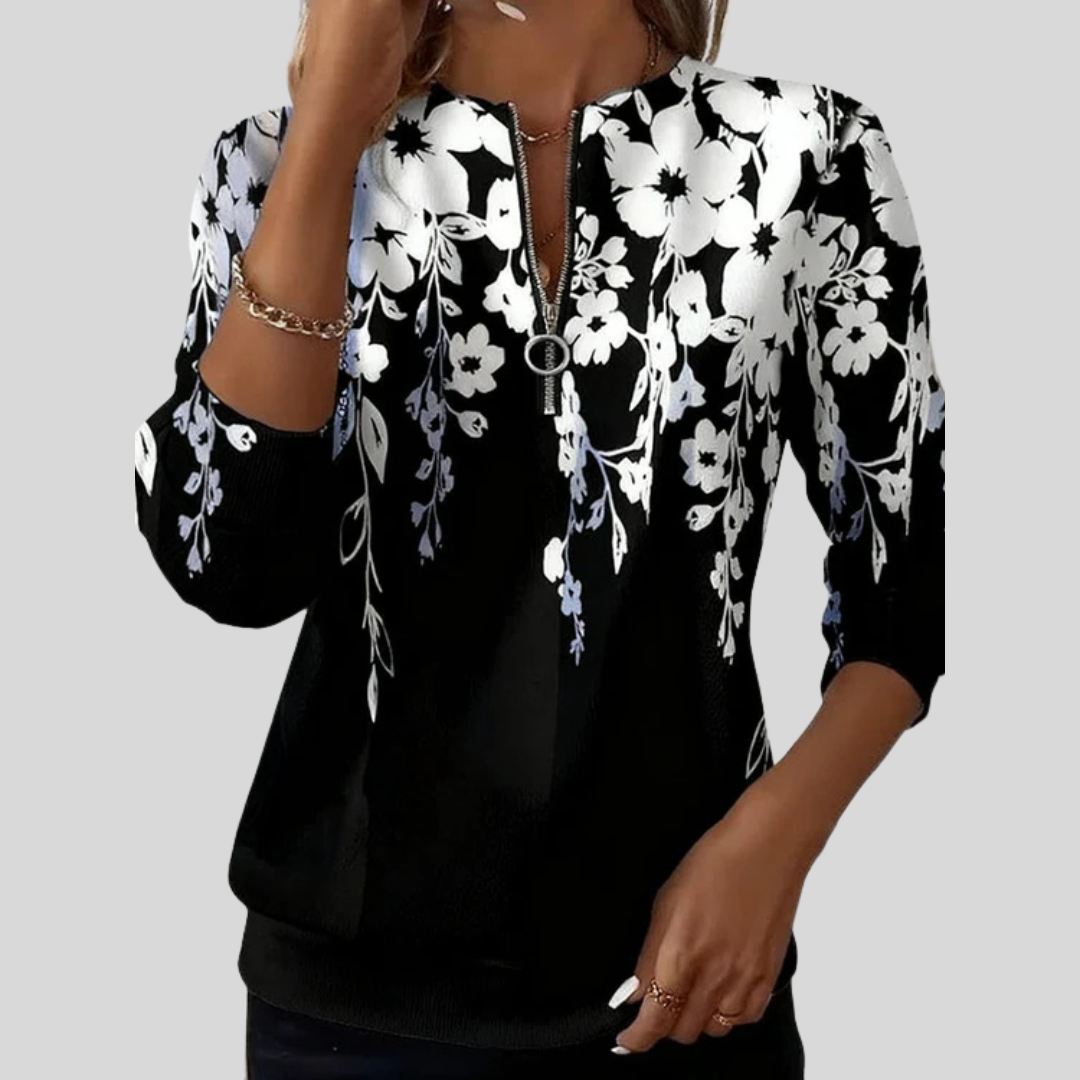Blusa de punto con estampado floral y cremallera