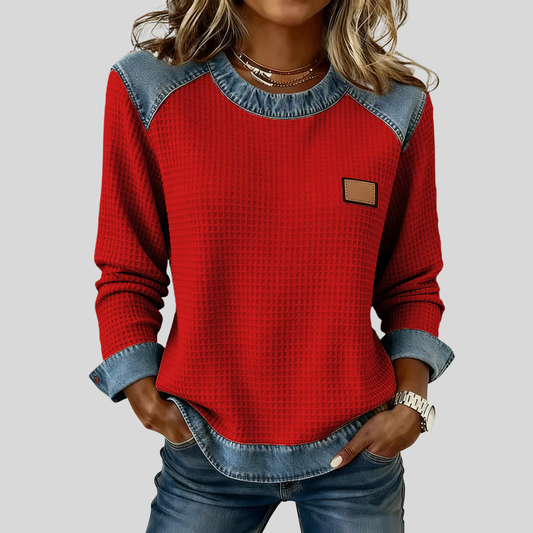 Blusa de punto con detalles de denim