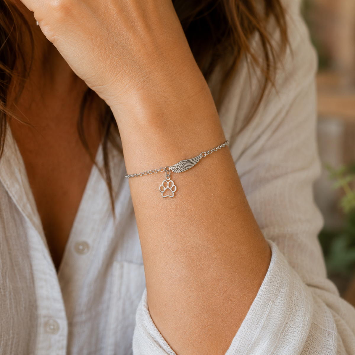 Pulsera con ala de ángel y huella de patita