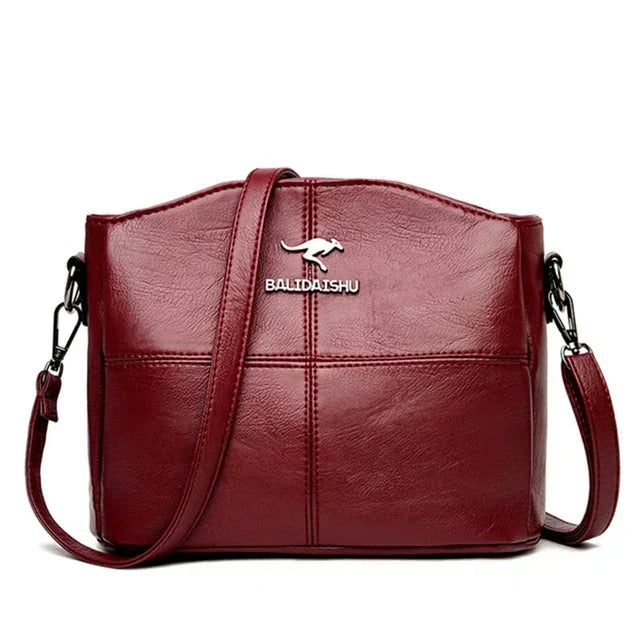 Bolsa bordada de microfibra con correa crossbody
