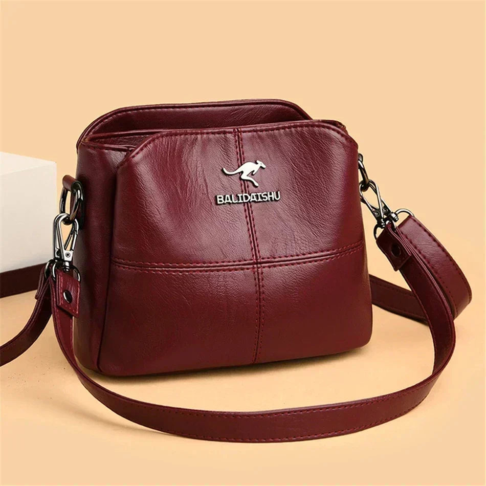 Bolsa bordada de microfibra con correa crossbody