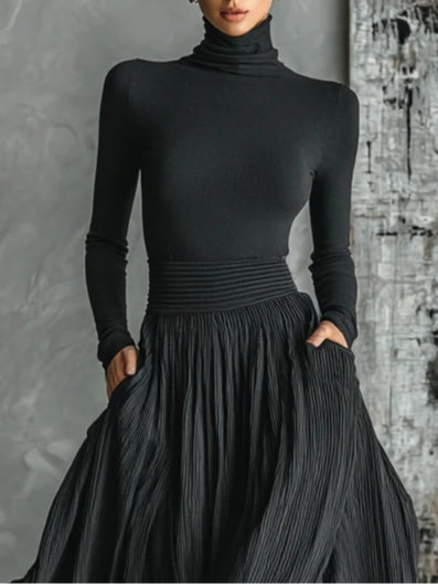 Conjunto de falda plisada y playera de cuello alto