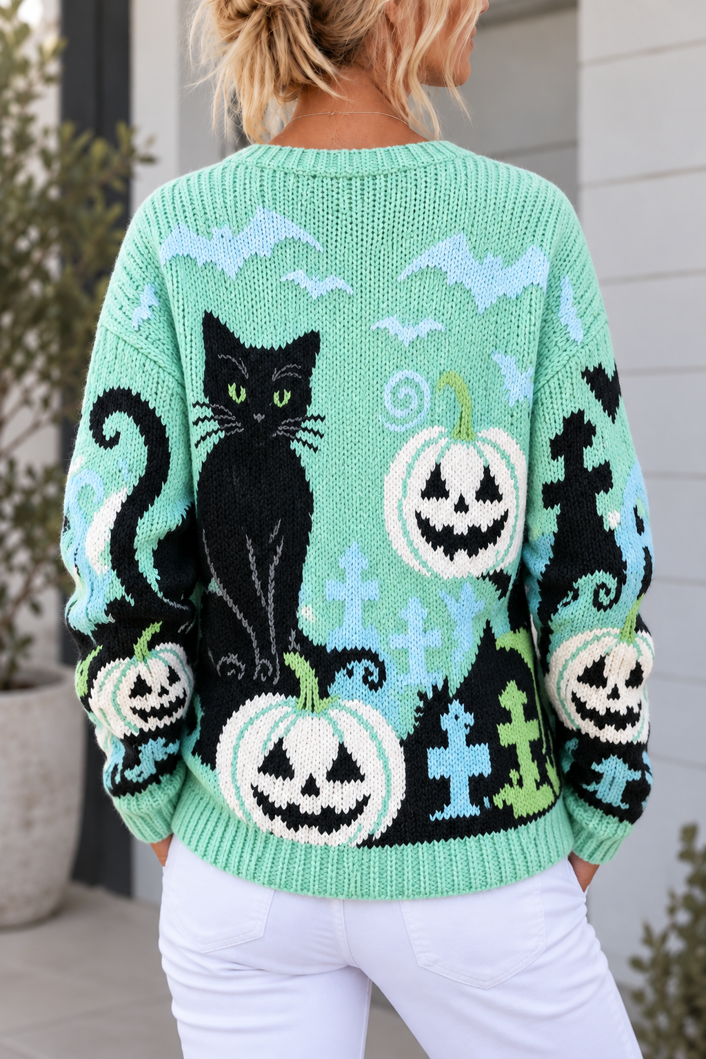 Cárdigan tejido con gato negro y calabazas